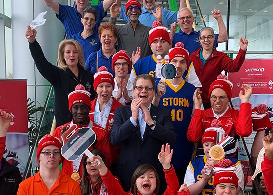 Special Olympic athletes rallying together with CEO, Michael Medline.